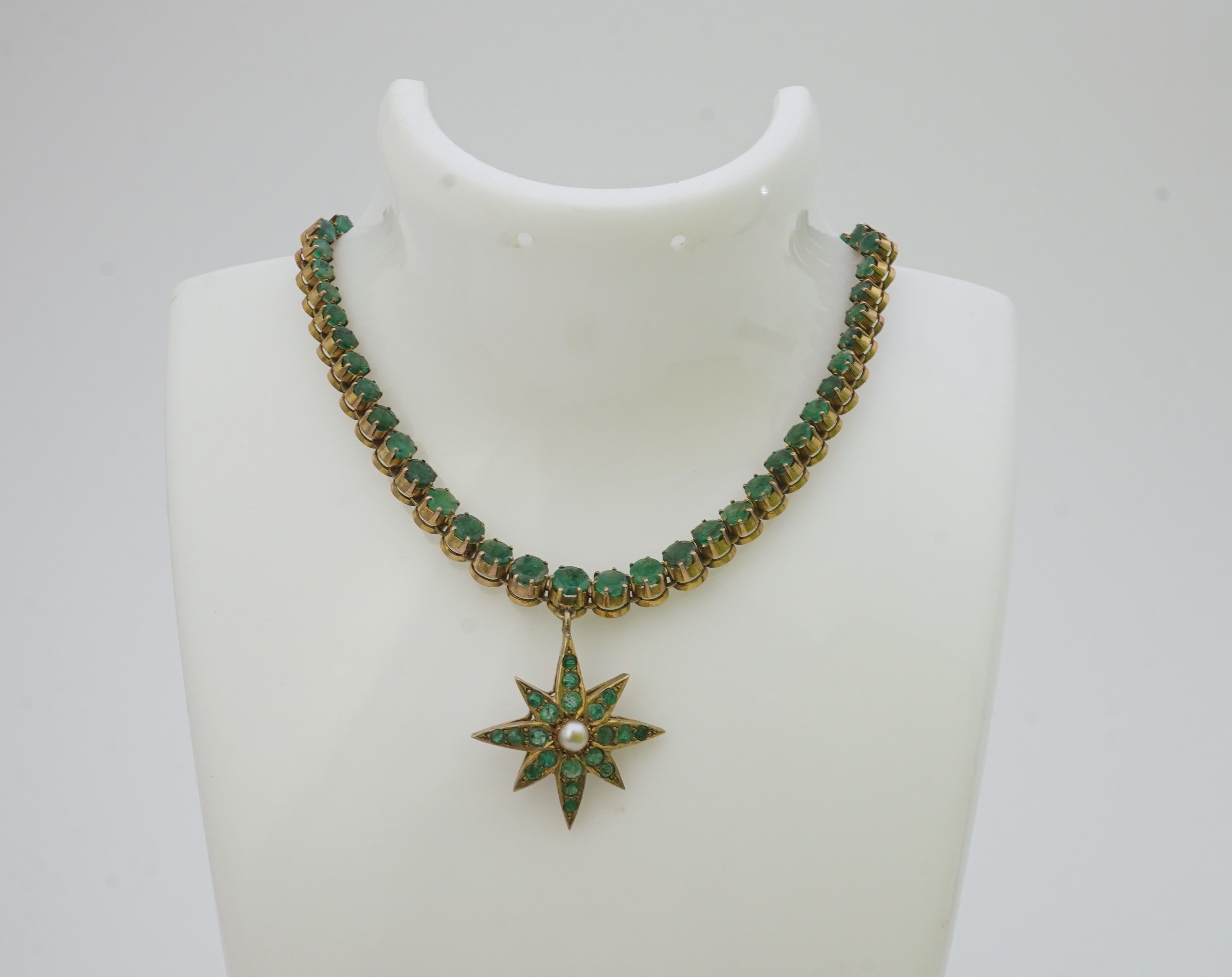 An emerald and pearl necklace